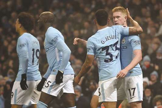 Manchester Cityu2019s Belgian midfielder Kevin De Bruyne (R) celebrates with teammate Gabriel Jesus after scoring against Tottenham Hotspur during their EPL match yesterday. (AFP)