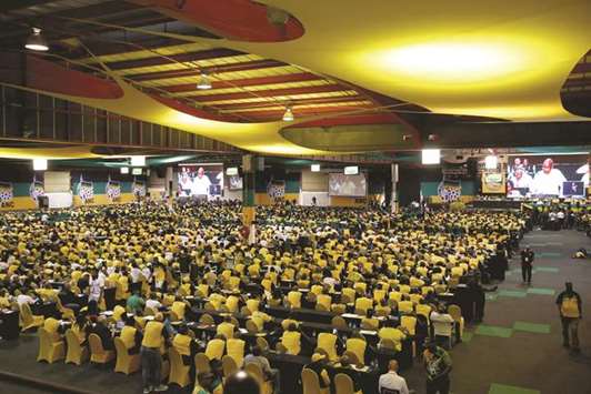 ANC members and delegates attend the 54th National Conference of the ruling African National Congress (ANC) at the Nasrec Expo Centre in Johannesburg yesterday.