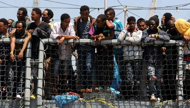 Migrants wait to disembark in Germany