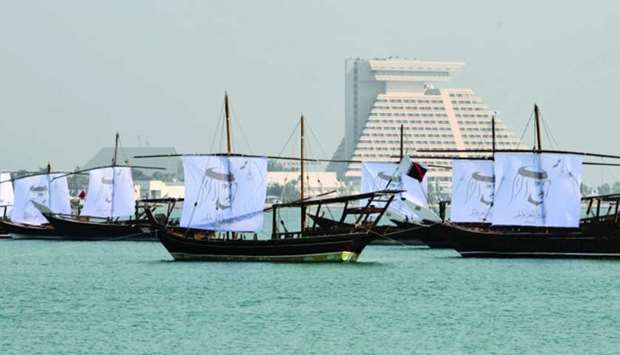 The dhows at Doha Corniche decorated with sails imprinted with portraits of His Highness the Emir Sheikh Tamim bin Hamad al-Thani and the national flag. PICTURE: Noushad Thekkayil
