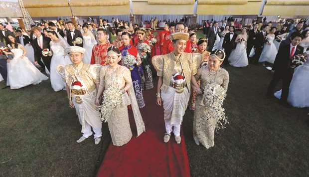 Chinese couples attend a mass wedding ceremony in Colombo yesterday.