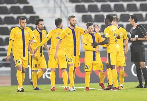 Al Gharafa players celebrate their QSL CUP semi-final win against Umm Salal on Saturday.