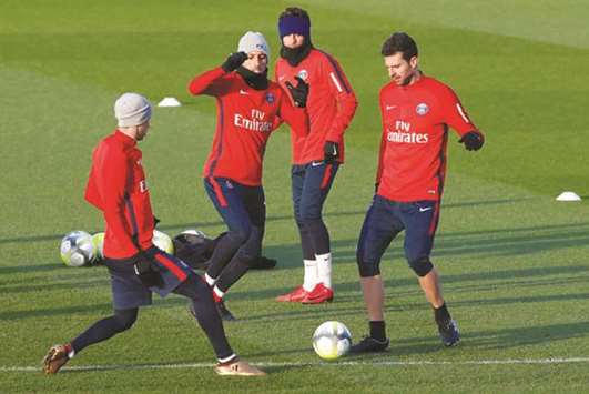 Paris Saint-Germainu2019s Marquinhos, Thiago Motta and Neymar during a training session yesterday. (Reuetrs)