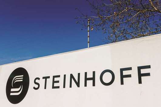 A Steinhoff International logo sits on display outside the companyu2019s  offices in Stellenbosch, South Africa. On December 6 as Steinhoffu2019s shares began a two-day plunge that cut the price by 80% and lopped some u20ac10bn ($11.8bn) from its market value.