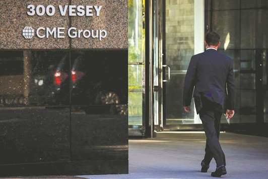 A man enters the CME Group offices in New York (file). Bitcoin futures got a muted reception after their debut on CME on Sunday, with volumes in the tens of millions of dollars in the first 12 hours of trading, as warnings about the risks of bitcoin sounded ever louder.