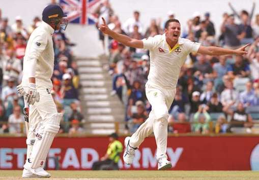 Australiau2019s Josh Hazlewood celebrates after dismissing Englandu2019s Craig Overton during the fifth day of the third Ashes cricket test match.
