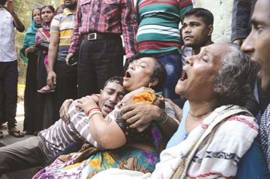 Relatives mourn as 10 people died in a stampede in Chittagong district of Bangladesh yesterday.