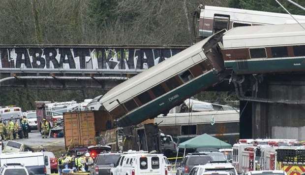 The scene of a portion of the Interstate I-5 highway after an Amtrak high speed train derailled from