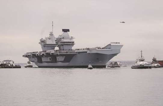 FILE PHOTO: The Royal Navyu2019s new aircraft carrier HMS Queen Elizabeth arrives in Portsmouth, Britain August 16, 2017.
