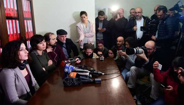 German journalist and translator Mesale Tolu (L) speaks to the media after being released under judicial control in Istanbul