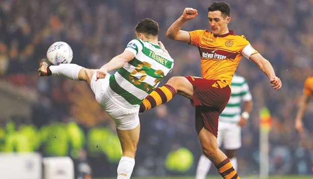 Celticu2019s Kieran Tierney vying for the ball with Motherwellu2019s Carl McHugh during their Scottish League Cup final. (Reuters)