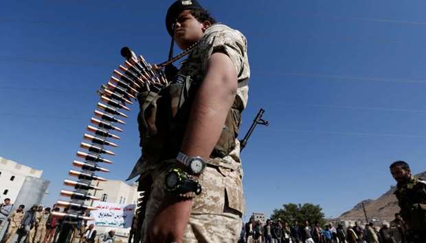 Houthi militant takes part in a parade
