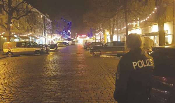 A police officer is seen after the Potsdam Christmas market and surrounding area had been cordoned off.