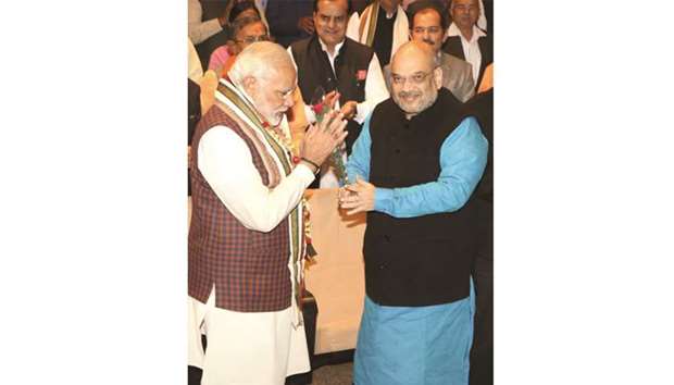 BJP president Amit Shah greets Prime Minister Narendra Modi during the BJP Parliamentary Party meeting at Parliament House in New Delhi  yesterday. Modi asked party MPs not to get distracted by Rahul Gandhi questioning his (Modiu2019s) credibility and told them to strengthen the organisation at the grassroots by promoting young leaders for the 2019 Lok Sabha election.