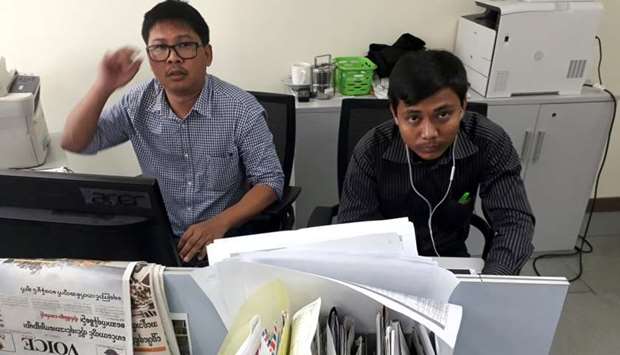 Reuters journalists Wa Lone (L) and Kyaw Soe Oo, who are based in Myanmar, pose for a picture at the Reuters office in Yangon, Myanmar December 11, 2017