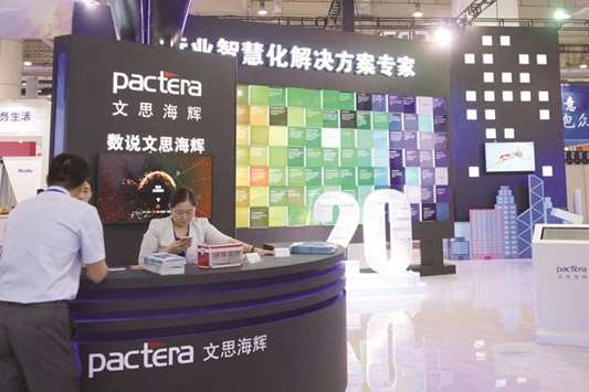 A booth of HNA Groupu2019s IT outsourcing unit Pactera is seen at a trade fair in Dalian, Liaoning province. HNA last month agreed to a termination fee exceeding 5% of the A$400mn ($305mn) enterprise value for its planned acquisition of Automotive Holdingsu2019s business that transports refrigerated products, according to a person familiar with the matter.