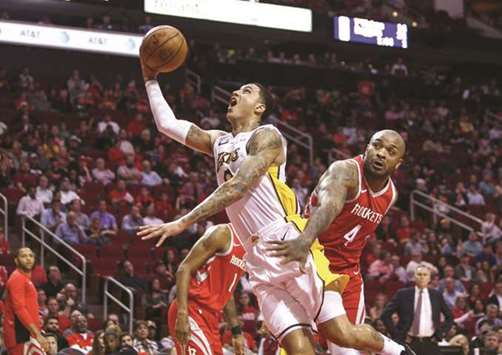 Los Angeles Lakers forward Kyle Kuzma (0) shoots against Houston Rockets forward PJ Tucker (4) during the third quarter against the Houston Rockets at Toyota Center. (USA TODAY Sports)