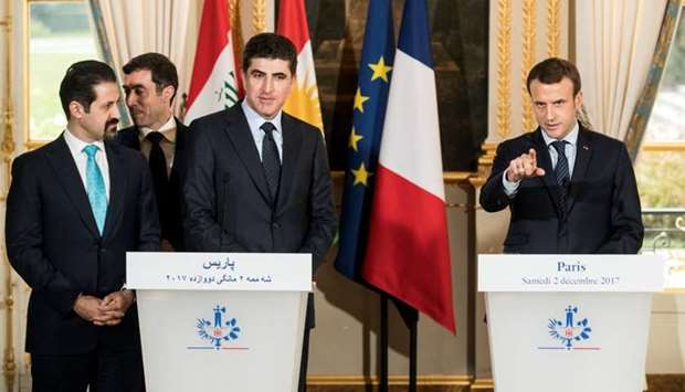 French President Emmanuel Macron (R), Kurdish region's Prime Minister Nechirvan Barzani and Iraqi Kurdistanu2019s Deputy Prime Minister Qubad Talabani (L) attend a press conference at the Elysee Palace following a meeting in Paris.