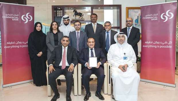 Abraham and other senior officials with the u2018Best Cash Management Bank in Qataru2019 award.