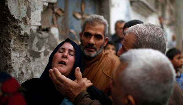 Relatives of a Palestinian demonstrator who was killed during clashes with Israeli troops on Friday, mourn during his funeral in the northern Gaza Strip. Reuters