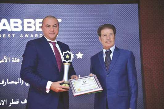 QIB Group CEO Bassel Gamal receives the Arab Best awards for the bank.