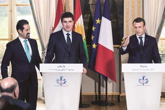 French President Emmanuel Macron, Kurdish regionu2019s Prime Minister Nechirvan Barzani and Iraqi Kurdistanu2019s Deputy Prime Minister Qubad Talabani (left) attend a press conference at the Elysee Palace following a meeting in Paris.