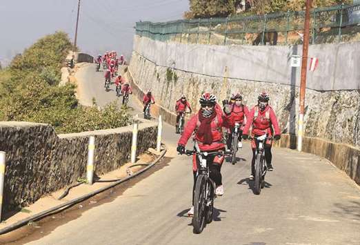 Buddhist nuns set off on a month-long bicycle journey on the outskirts of Kathmandu yesterday.
