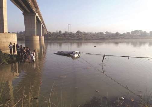 A bus is pulled from the Banas River after a deadly accident in Sawai Madhopur, some 160km from Jaipur, yesterday.