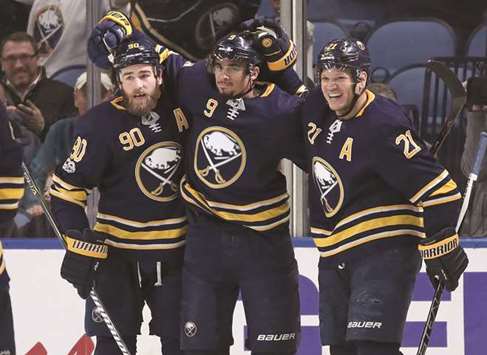 Buffalo Sabres centre Ryan Ou2019Reilly (left) left wing Evander Kane and right wing Kyle Okposo (right) celebrate a goal against the Philadelphia Flyers during the third period of their NHL game at KeyBank Centre yesterday. PICTURE: USA TODAY Sports