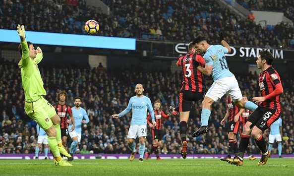 Manchester Cityu2019s Sergio Aguero (right) scores against Bournemouth during the Premier League match in Manchester, north west England, yesterday. (AFP)