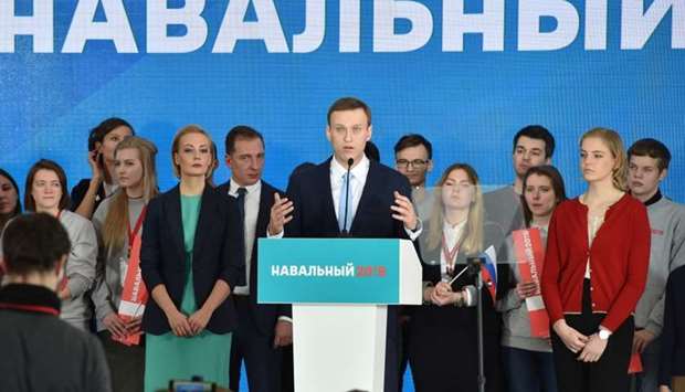 Russian opposition leader Alexey Navalny delivers a speech during a meeting with his supporters in Moscow.