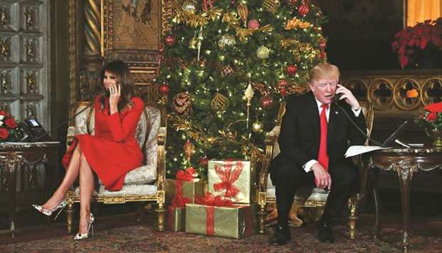 US President Donald J Trump and the First Lady Melania Trump participate in NORAD Santa Tracker phone calls at the Mar-a-Lago resort in Palm Beach, Florida.