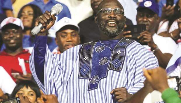 George Weah, former football player and presidential candidate of Congress for Democratic Change, reacts while a speech during the partyu2019s presidential campaign rally at Samuel Kanyon Doe Sports Complex in Monrovia, Liberia, on Sunday. (Reuters)