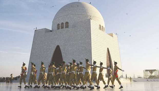 Naval cadets parade at the mausoleum of the u2018father of the nationu2019 Quaid-e-Azam Muhammad Ali Jinnah during events to mark his birth anniversary in Karachi.