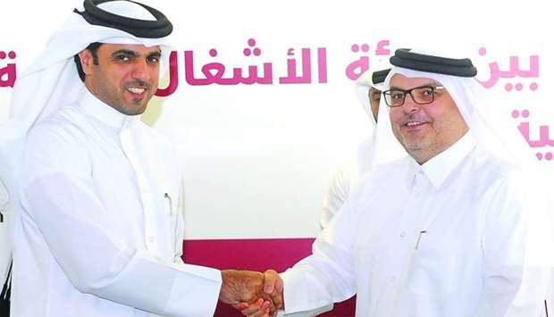 QFFD director general Khalifa bin Jassim al-Kuwari and Ashghal president and senior engineer Saad bin Ahmad al-Muhannadi at the signing ceremony. PICTURE: Shemeer Rasheed