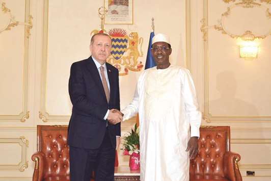 Turkish President Recep Tayyip Erdogan shakes hands with Chadu2019s President Idriss Deby at the presidential palace ahead of a meeting, in Nu2019Djamena, yesterday.