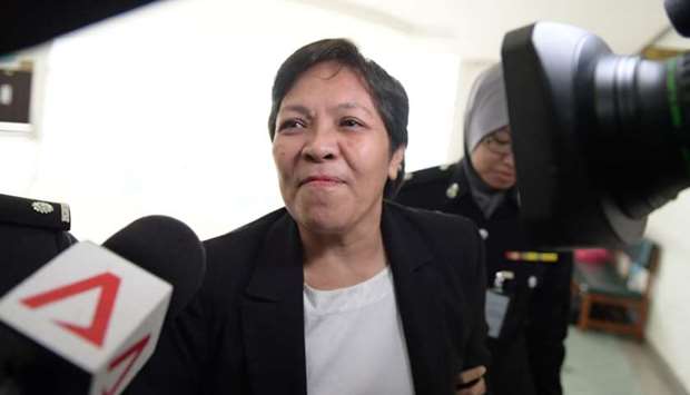 Maria Elvira Pinto Exposto reacts after she was cleared of drug trafficking charges at Shah Alam High Court in Shah Alam, outside Kuala Lumpur