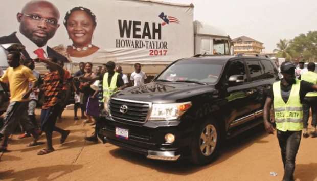 George Weah arrives at party headquaters in Monrovia.