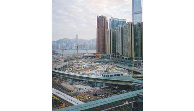 A general view shows the construction site (foreground) of the West Kowloon terminus of the high-speed rail link which will connect the city to the southern Chinese city of Guangzhou, as Hong Kongu2019s skyline looms in the background yesterday.