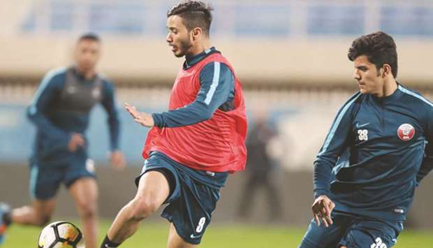 Qatar players take part in a training session in Kuwait City.