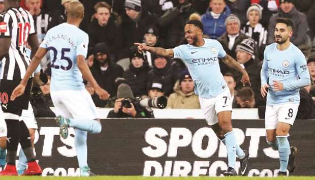 Manchester Cityu2019s Raheem Sterling (second right) celebrates after scoring against Newcastle United during the Premier League match on Wednesday night. (Reuters)