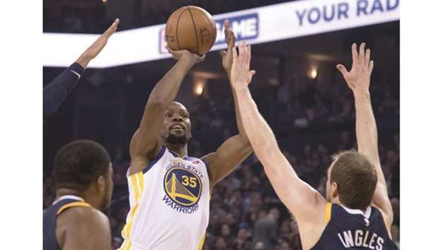 Golden State Warriors forward Kevin Durant (No 35) shoots the basketball against Utah Jazz forward Joe Ingles (right) during the first quarter at Oracle Arena. PICTURE: USA TODAY Sports