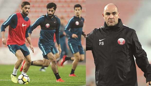 Qatar captain Hassan al-Haydos (left) takes part in a training session on the eve of their match against Bahrain yesterday. (RIGHT PHOTO) Qatar coach Felix Sanchez.