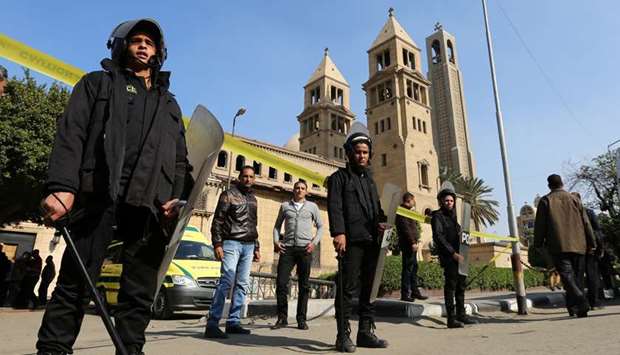 Members of the special police forces stand guard to secure the area around St. Marku2019s Coptic Orthodox Church, Cairo, after it was bombed on December 11, 2016.