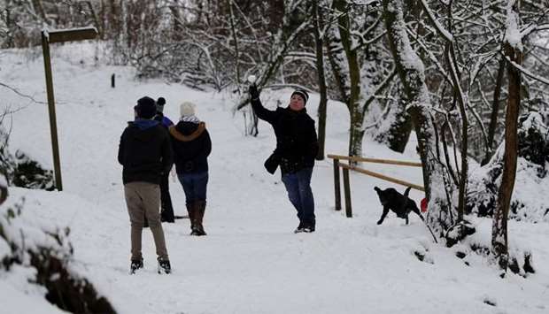 A man throws a snowball in Buxton