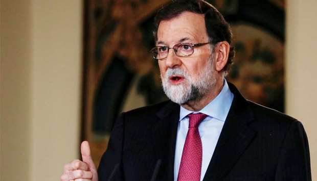 Spain's Prime Minister Mariano Rajoy gestures while delivering his year-end speech at the Moncloa Palace in Madrid
