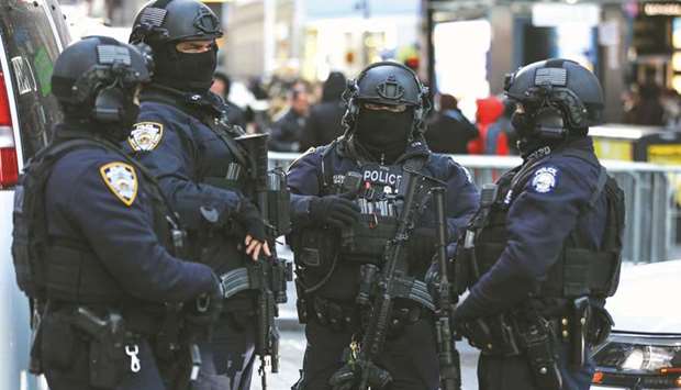 New York Police Department Counterterrorism Bureau members stand in Times Square.