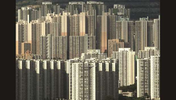 Public and private housing blocks are seen in Hong Kong. Private home prices in Hong Kong rose by 1.08% in November, marking the fastest pace of growth in six months, according to data compiled by the Rating and Valuation Department released yesterday.
