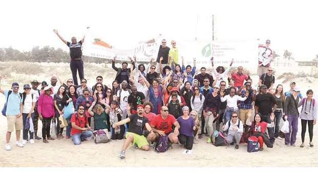 GROUP PHOTO: The volunteers before they set out to clean the area.       Photos by Jayan Orma