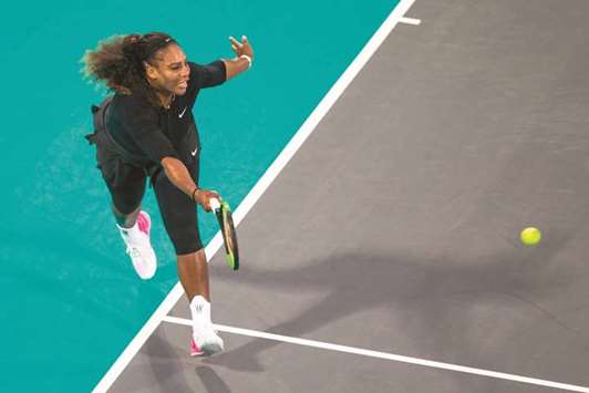 Serena Williams of the US returns the ball to Jelena Ostapenko of Latvia during the Mubadala World Tennis Championship 2017 match in Abu Dhabi yesterday. (AFP)
